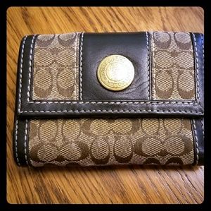 Brown and tan coach wallet.